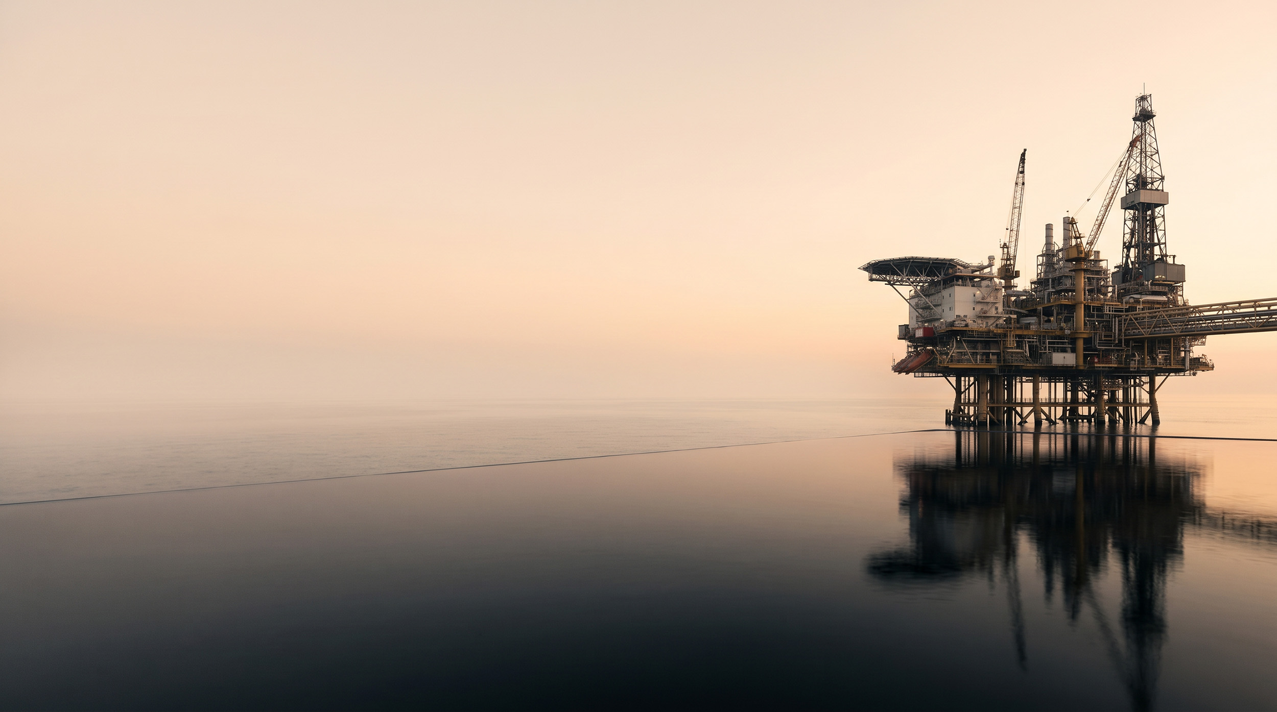 Offshore drilling platform at dusk