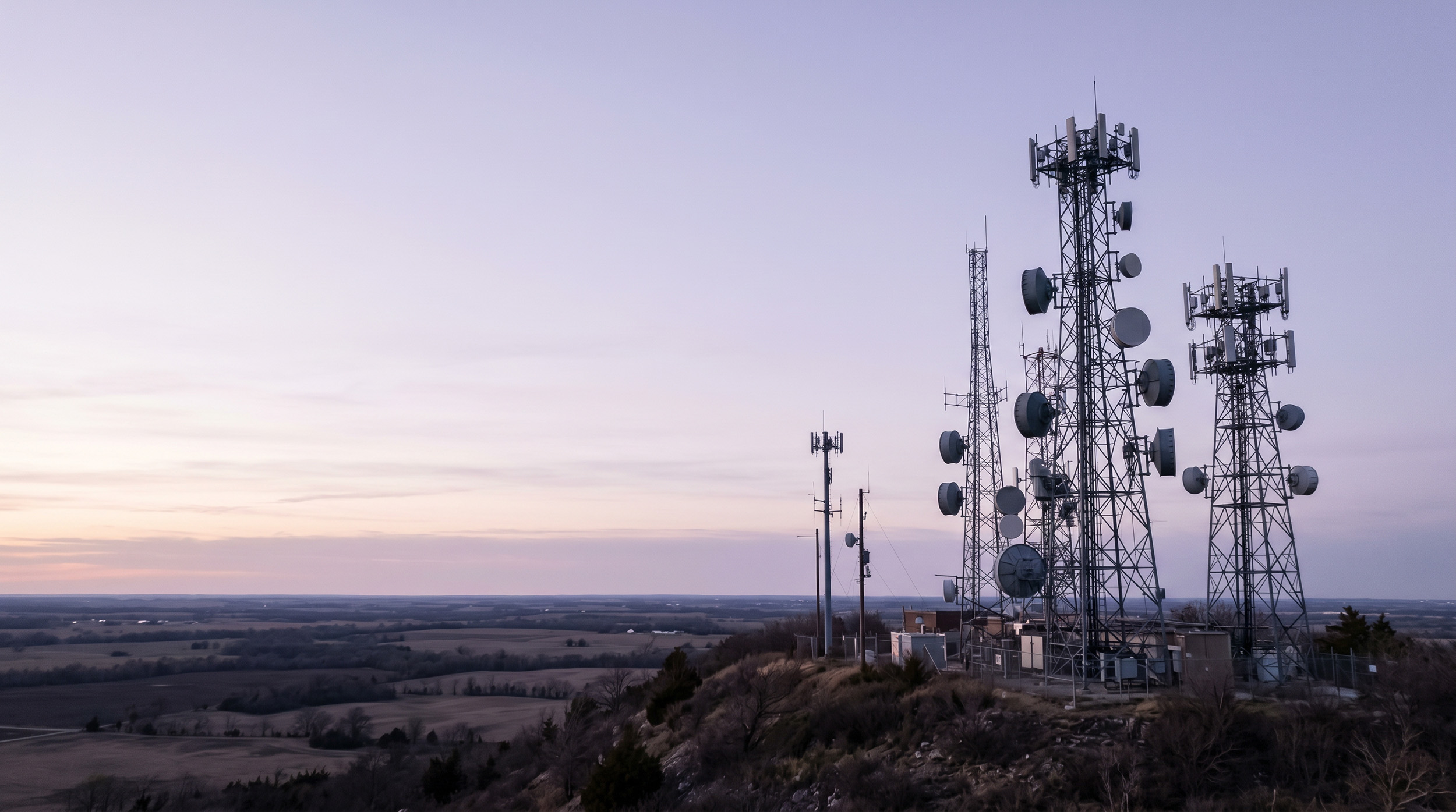 Cell and radio towers at dusk