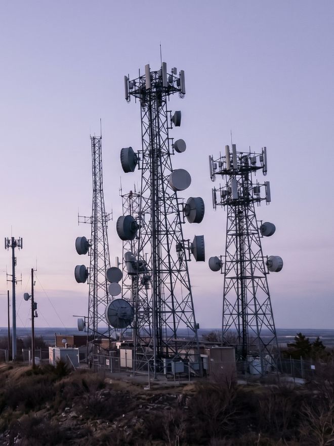 Telecom towers at dusk